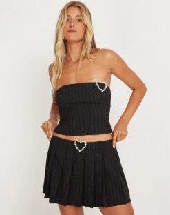 Ayumi Pleated Mini Skirt In Black Pinstripe With Heart Buckle -Outlet Modi Vora Store AYUMI SKIRT BLACK PINSTRIPE 17 W HEART BUCKLE 169034